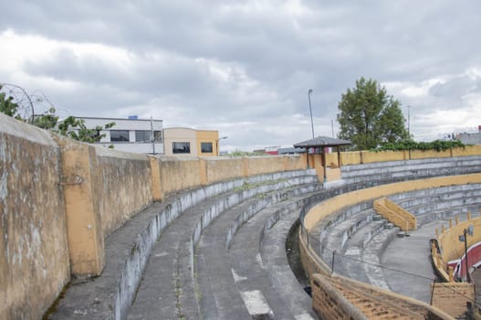 empty amphitheater without people of an abandoned and old bullring. High quality photo