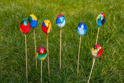 Marbled colored colorful easter eggs isolated with selective focus in the garden