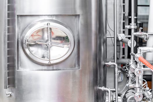 stainless steel tanks for brewing beer in a brewery. High quality photo