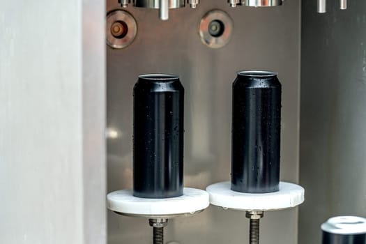 automatic filling and sealing of drink cans in the factory.