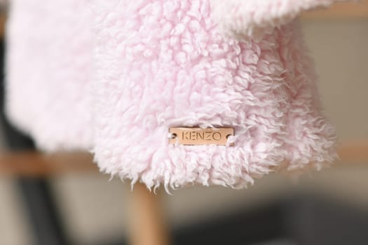 PARIS - FRANCE - 05 March 2023 - Kenzo label on a jacket for a girl