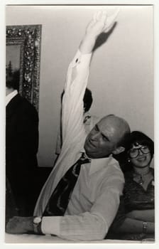 THE CZECHOSLOVAK SOCIALIST REPUBLIC - CIRCA 1980s: Vintage photo shows drunk man during a party.