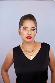 portrait shot of a young Ukrainian woman on the background, after make-up and hairstyle, for clothing advertising.