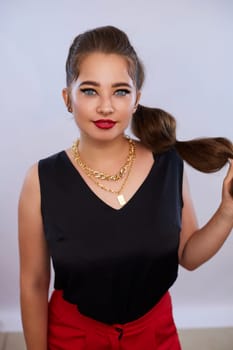 portrait shot of a young Ukrainian woman on the background, after make-up and hairstyle, for clothing advertising.