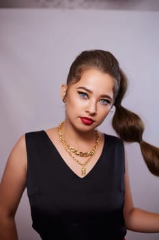 portrait shot of a young Ukrainian woman on the background, after make-up and hairstyle, for clothing advertising.