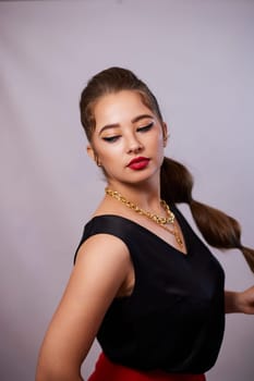 portrait shot of a young Ukrainian woman on the background, after make-up and hairstyle, for clothing advertising.