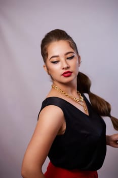 portrait shot of a young Ukrainian woman on the background, after make-up and hairstyle, for clothing advertising.