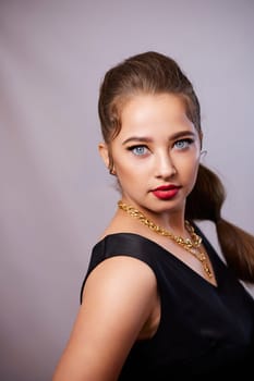 portrait shot of a young Ukrainian woman on the background, after make-up and hairstyle, for clothing advertising.