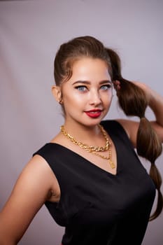 portrait shot of a young Ukrainian woman on the background, after make-up and hairstyle, for clothing advertising.