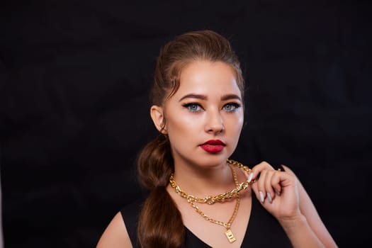 portrait shot of a young Ukrainian woman on the background, after make-up and hairstyle, for clothing advertising.