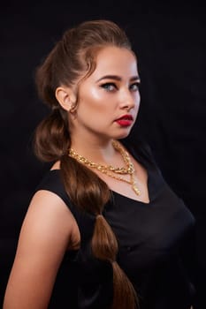 portrait shot of a young Ukrainian woman on the background, after make-up and hairstyle, for clothing advertising.