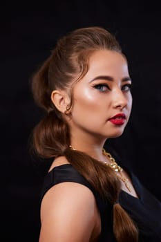 portrait shot of a young Ukrainian woman on the background, after make-up and hairstyle, for clothing advertising.