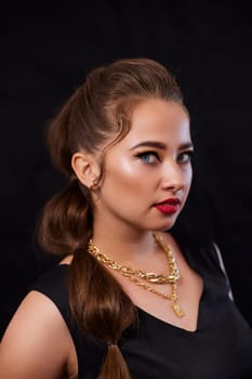 portrait shot of a young Ukrainian woman on the background, after make-up and hairstyle, for clothing advertising.