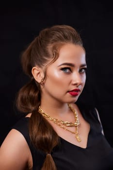 portrait shot of a young Ukrainian woman on the background, after make-up and hairstyle, for clothing advertising.