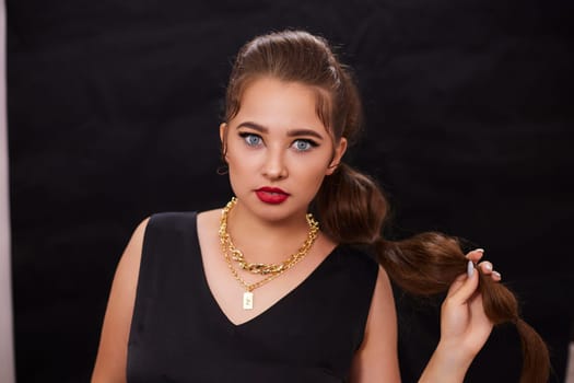 portrait shot of a young Ukrainian woman on the background, after make-up and hairstyle, for clothing advertising.