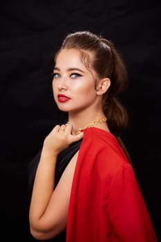 portrait shot of a young Ukrainian woman on the background, after make-up and hairstyle, for clothing advertising.