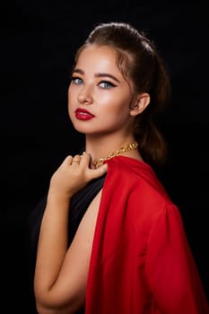 portrait shot of a young Ukrainian woman on the background, after make-up and hairstyle, for clothing advertising.