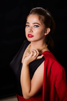 portrait shot of a young Ukrainian woman on the background, after make-up and hairstyle, for clothing advertising.