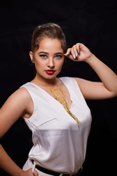 portrait shot of a young Ukrainian woman on the background, after make-up and hairstyle, for clothing advertising.