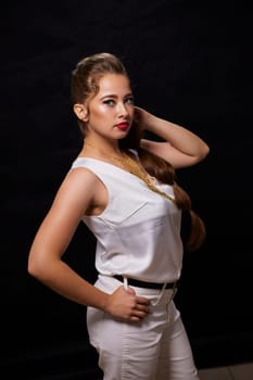 portrait shot of a young Ukrainian woman on the background, after make-up and hairstyle, for clothing advertising.