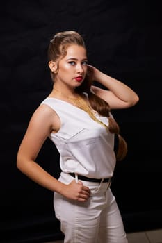 portrait shot of a young Ukrainian woman on the background, after make-up and hairstyle, for clothing advertising.