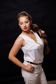 portrait shot of a young Ukrainian woman on the background, after make-up and hairstyle, for clothing advertising.