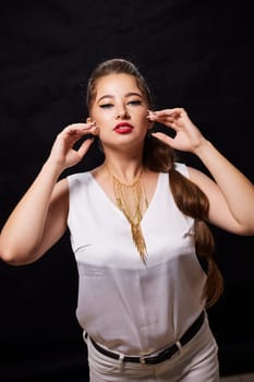 portrait shot of a young Ukrainian woman on the background, after make-up and hairstyle, for clothing advertising.