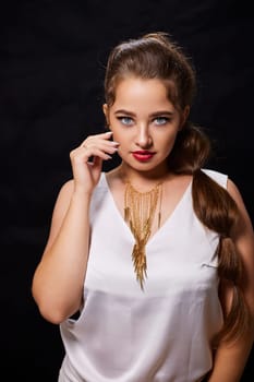 portrait shot of a young Ukrainian woman on the background, after make-up and hairstyle, for clothing advertising.