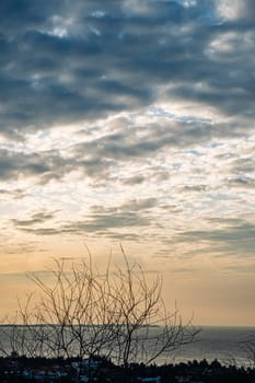 Abstract background sky Dawn Sunset Contrast dark shadow bright cloud sun orange silhouette above the mountains near the sea.