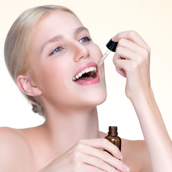 Closeup personable portrait of beautiful woman applying essential oil bottle for skincare product. Cannabis extracted CBD oil dropper for treatment and cannabinoids concept in isolated background.