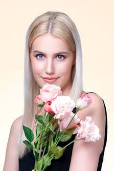 Closeup young personable woman with natural makeup and healthy soft skin holding rose for beauty care advertising in isolated background. Beautiful pretty model girl with flower concept.