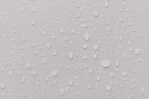 Water drops an gray surface. Abstract water drops background