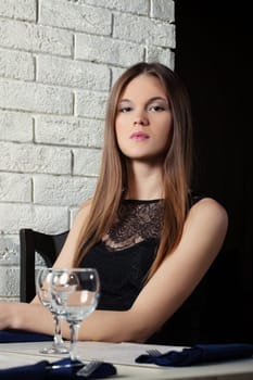 Portrait of sensual young girl posing in cafe, close-up