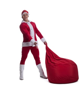 Full length portrait of young Santa with red bag. Isolated on white