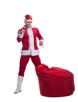 Full length portrait of young Santa Claus with bag. Isolated on white