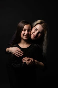 portrait of young woman with her little girl.