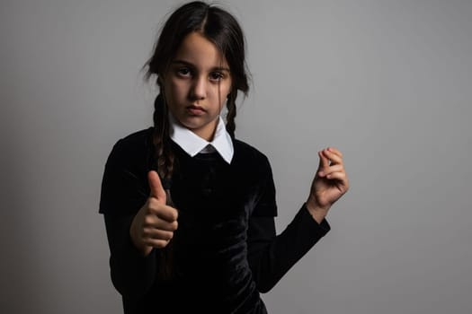 a girl Wednesday Addams. Halloween party.