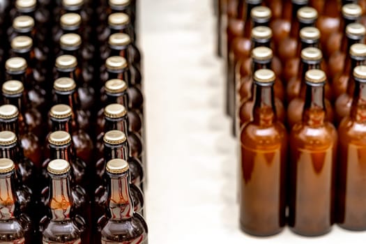 glass bottles with beer in the warehouse of the brewery. High quality photo