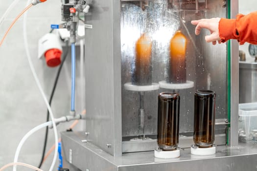 machine for automatic filling of beer bottles in a brewery. High quality photo