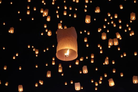 Tourist floating sky lanterns in Loy Krathong festival , Chiang Mai ,Thailand.