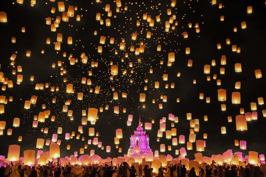 Tourist floating sky lanterns in Loy Krathong festival , Chiang Mai ,Thailand.
