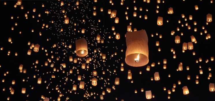 Tourist floating sky lanterns in Loy Krathong festival , Chiang Mai ,Thailand.