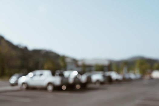 Blur car park with many cars abstract background. Vintage tone color.