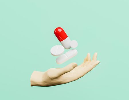 hand with pills floating on it. concept of medication, pharmacy and care. 3d rendering