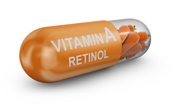 Capsule with an inscription vitamin A and retinol filled with carrots