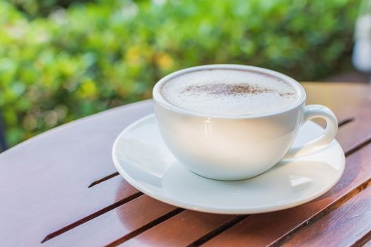 Hot cocoa cup drink on wooden table