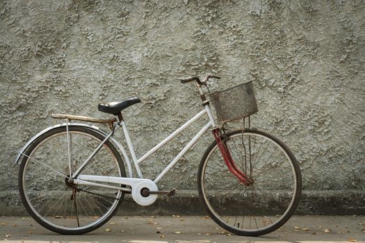 Old bicycle vintage with wall backdrop concrete