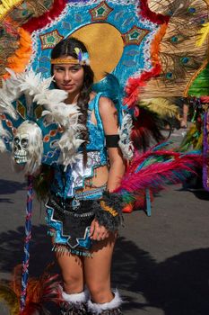 Arica, Chile - January 23, 2016: Tobas dancers in traditional Andean costume performing at the annual Carnaval Andino con la Fuerza del Sol in Arica, Chile.