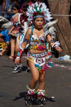 Arica, Chile - January 23, 2016: Tobas dancers in traditional Andean costume performing at the annual Carnaval Andino con la Fuerza del Sol in Arica, Chile.