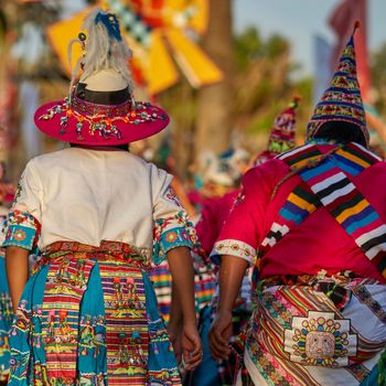 Arica, Chile - January 23, 2016: Tinkus dancing group in colourful costumes performing a traditional ritual dance as part of the Carnaval Andino con la Fuerza del Sol in Arica, Chile.